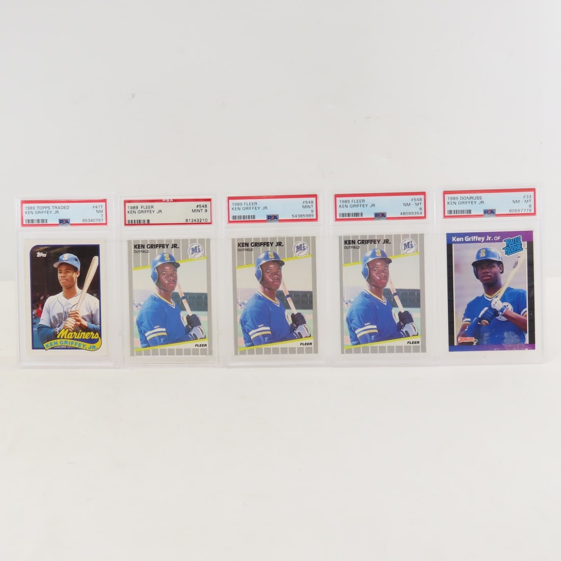 5 PSA Graded Ken Griffey Jr. 1989 Rookie Cards: 5 PSA Graded Ken Griffey Jr. 1989 Rookie Cards - 1989 Donruss Ken Griffey Jr. #33 PSA 8 NM-MT, 1989 Fleer #548 PSA 9 Mint x2, 1989 Fleer #548 PSA 8 NM-MT, 1989 Topps Traded Ken Griffey Jr. #41T PSA 7