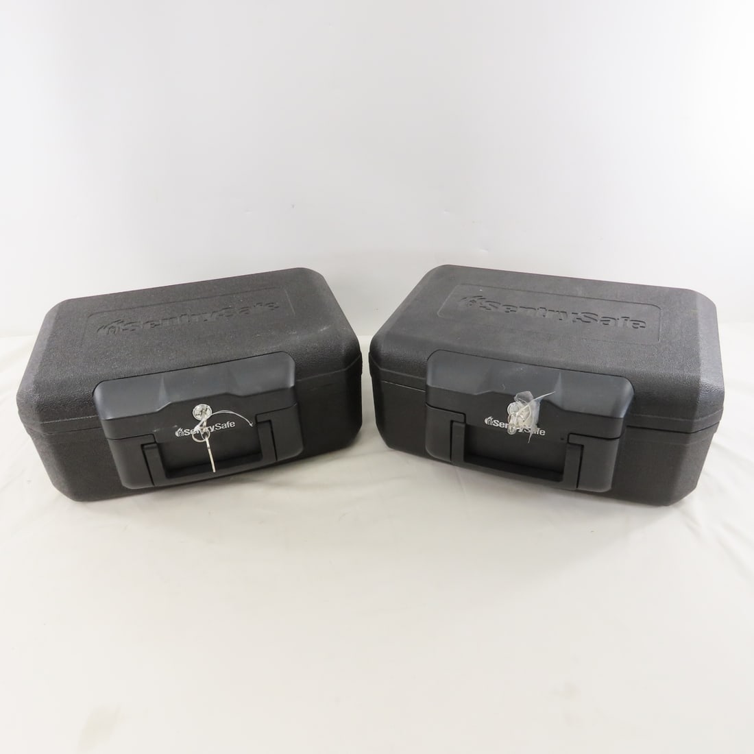 2 Portable Sentry Safes with Keys: 2 Portable Sentry Safes with Keys - Lot Size 15x13x13" 22 LB All information and photos are intended to be as accurate as possible, but errors are possible. No item may be returned or refused based