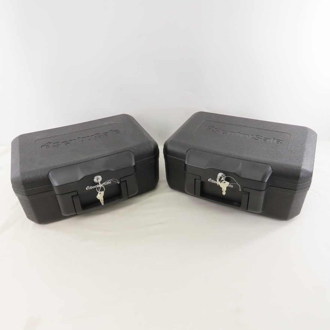 2 Portable Sentry Safes with Keys: 2 Portable Sentry Safes with Keys - Lot Size 15x13x13" 22 LB All information and photos are intended to be as accurate as possible, but errors are possible. No item may be returned or refused based