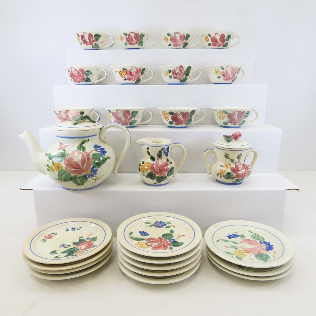 Red Wing Orleans Tea Service for 12 with Teapot: Red Wing Orleans Tea Service for 12 with Teapot - teapot with lid, sugar with lid, creamer, 12 cups and 11 saucers, 1 bread plate (same size as saucers). Most have some crazing and discoloration-