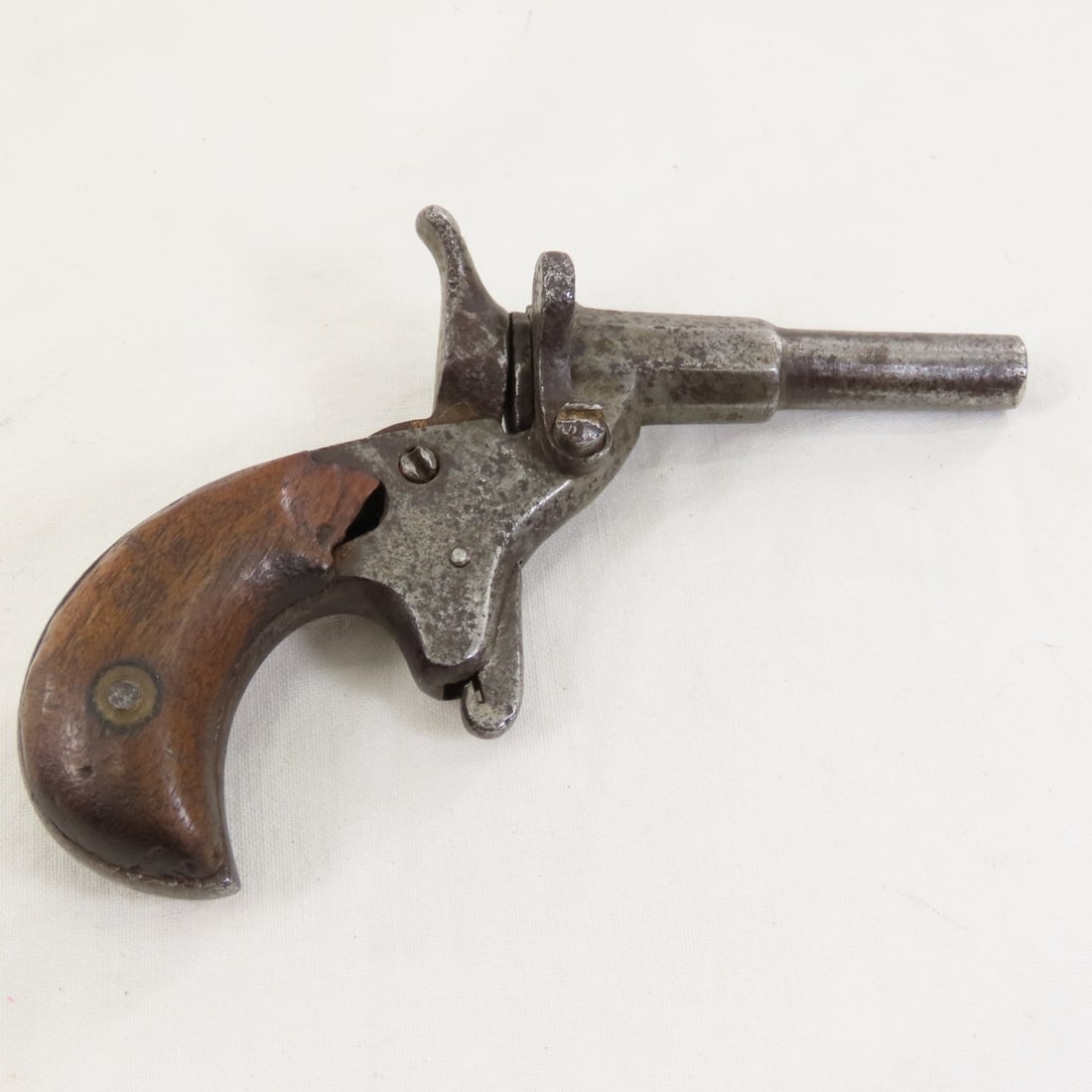 Antique Flobert 6mm Parlor Pistol: Antique Flobert 6mm Parlor Pistol - SN# 33 under grip, single shot, 2 1/8" octagon to round barrel, wood grips, No transfer required in MN, please know local laws before bidding. LOT SIZE: 4x3x2" 1
