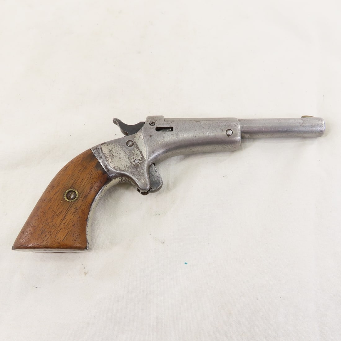 J Stevens A&T Co Model 41 .22 RF Pistol: J Stevens A&T Co Model 41 .22 RF Pistol - SN# 16961 under grip & barrel, tip-up, single shot. 3.5" octagon to round barrel, wood grips. Mfg 1903-1916. C&R or FFL transfer required, please know local