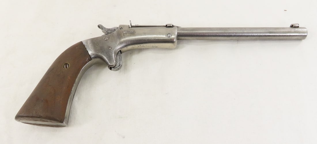 J Stevens Model 43 .22 RF Pistol: J Stevens Model 43 .22 RF Pistol - SN# 1799 on frame (hard to read) and 23198 on barrel, tip-up, 6" barrel octagon to round with front & rear sights, wood grips, manufactured from 1896 to 1916. C&R