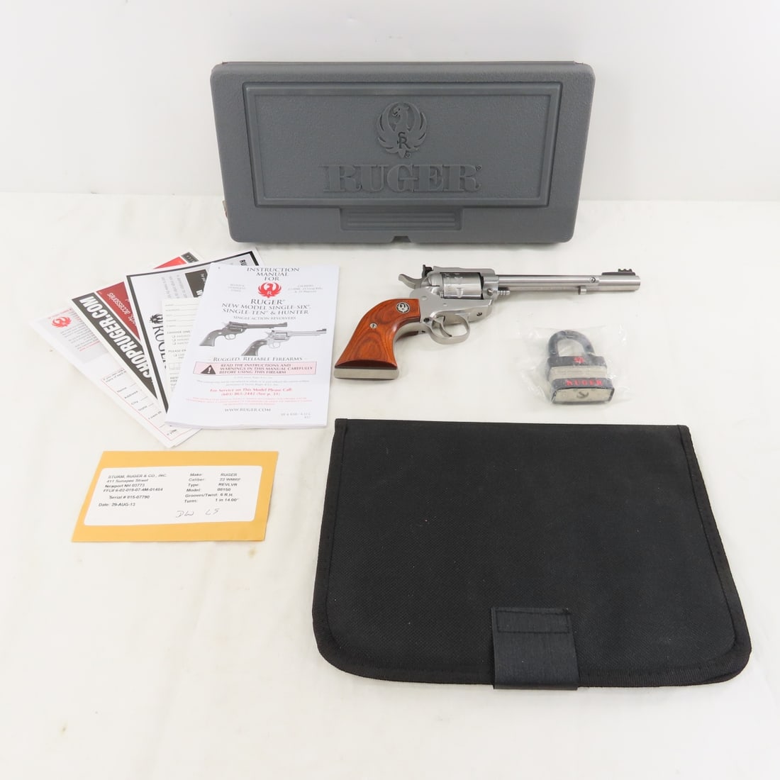 Ruger New Model Single-Nine .22 Win Mag Revolver: Ruger New Model Single-Nine .22 Win Mag Revolver - SN# 815-07790, 9 shot, 6" barrel, front 7 rear optic sights, all stainless, wood grips, in original case with lock and booklet. Mfg. 2013, very good