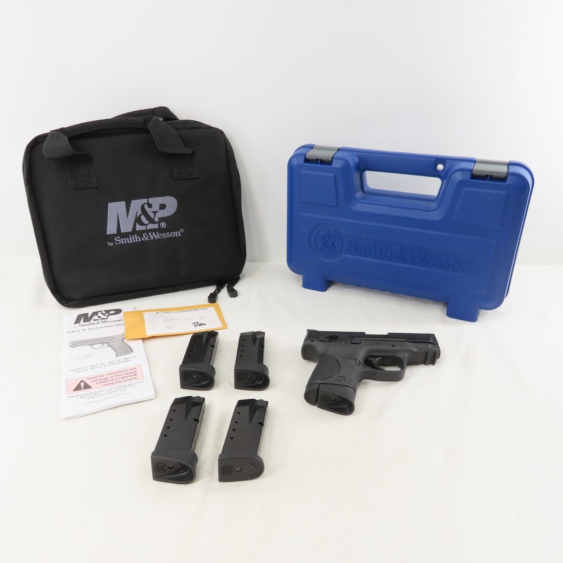 Smith & Wesson 40 C Pistol with 5 Magazines & Case: Smith & Wesson 40 C Pistol with 5 Magazines & Case - SN$ HVN1237, .40 S&W, 3.5" barrel, 3 dot sights, 3 9 round magazines, and 2 10 round .40 S&W/357 magazines. Overall good condition, in original