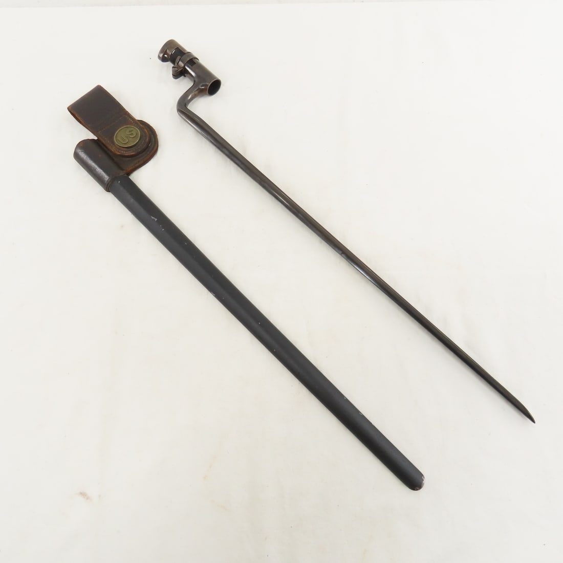 M1855 Socket Bayonet & Scabbard: M1855 Socket Bayonet & Scabbard - 18" blade & 21" OAL, marked US on ricasso. Scabbard with US button marked Watervliet Arsenal (NY) on front of leather belt loop. Leather on hanger marked H.H.L. and