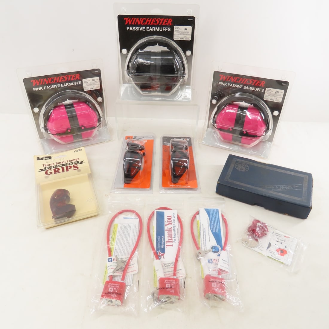 Shooting Glasses, Earmuffs & More: Shooting Glasses, Earmuffs & More - 3 Pair NEW Winchester earmuffs, 2 NEW shooting glasses, 3 long gun locks, 1 handgun lock, Taurus small frame wood grips, Smith & Wesson Model 36 box. LOT SIZE: