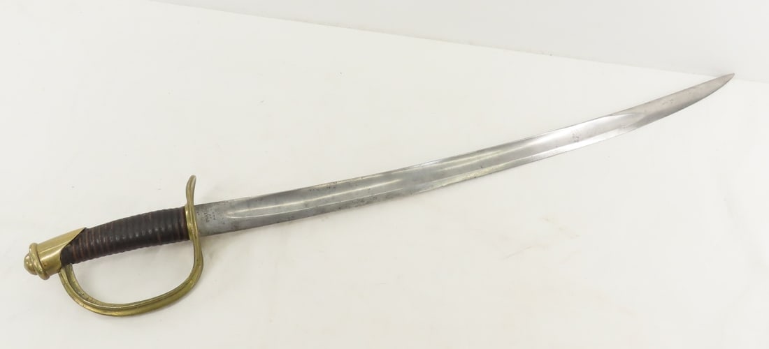 US Navy Model 1860 Boarding Cutlass: US Navy Model 1860 Boarding Cutlass - ricasso marked USN DR (Diane Reynolds inspector) 1862, brass pommel and knucklebow is missing basket, with leather grip- missing wire, 26" curved steel blade