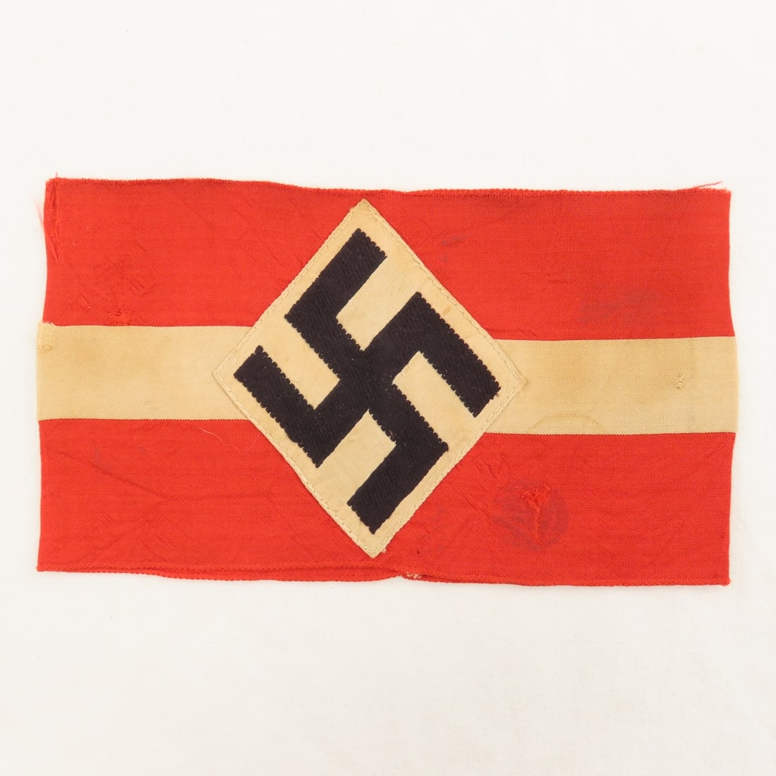 WWII German Hitler Youth Arm Band: WWII German Hitler Youth Arm Band - some tears in fabric, has old tape/glue residue on the back. Measures 7.25x4.25". LOT SIZE: 8x5x1" .5 LB All information and photos, which are part of the descripti