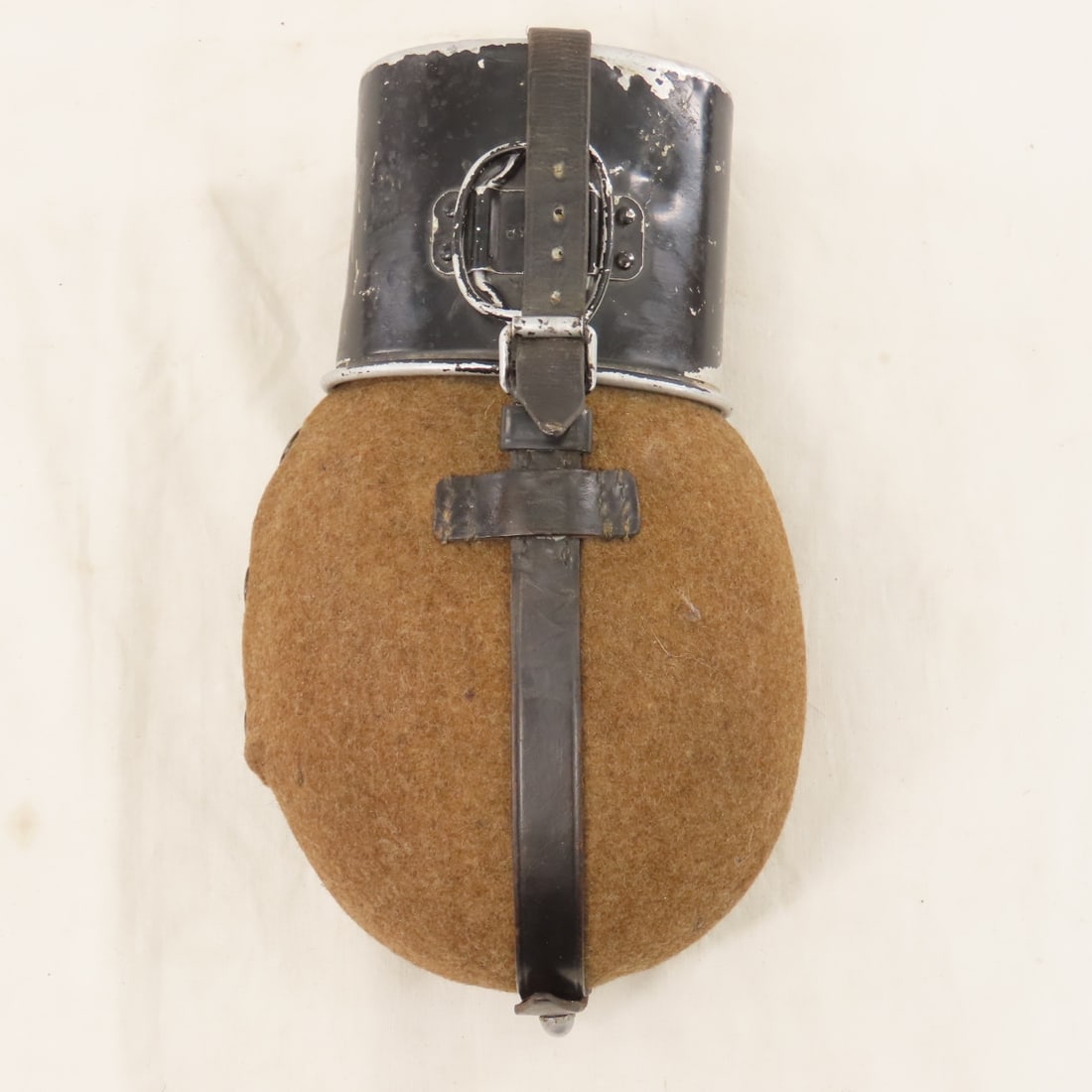 WWII German M31 Canteen with cup: WWII German M31 Canteen with cup - LOT SIZE: 10x6x4" 1 LB All information and photos, which are part of the description) are intended to be as accurate as possible, but errors are possible. No item ma