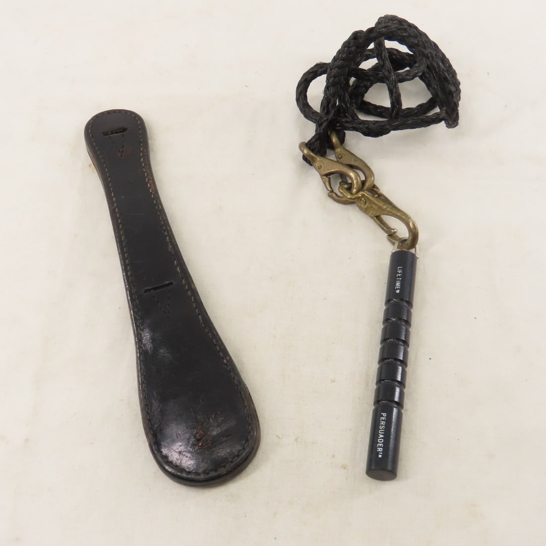 Bucheimer Slapjack & Lifetime Persuader: Bucheimer Slapjack & Lifetime Persuader - Lifetime persuader is the Monadnock 5.5" Persuader Kubaton, leather slapjack is 11", LOT SIZE: 12x4x3" 1.5 LBS All information and photos, which are part of