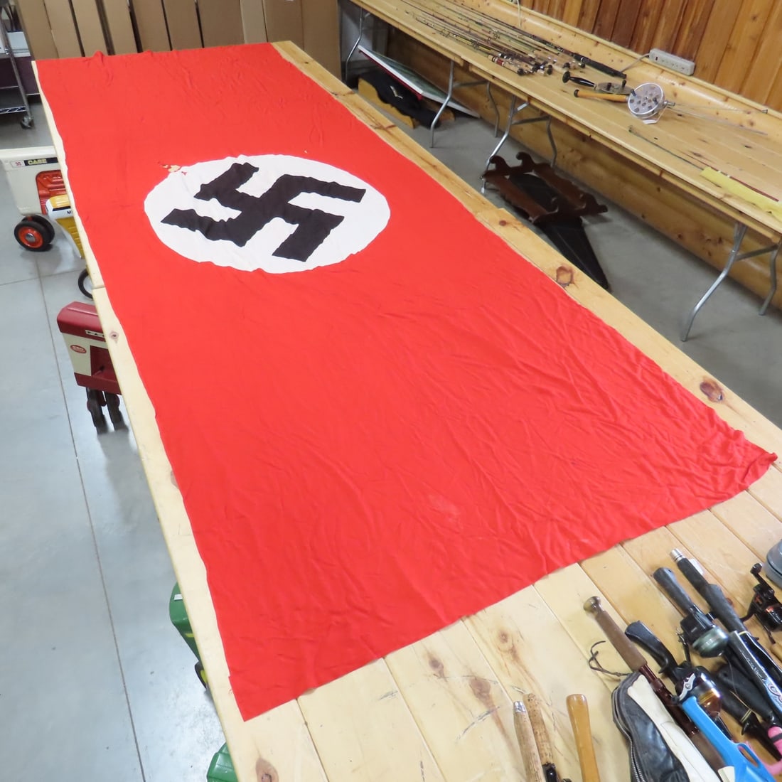 WWII German Swastika Banner Flag: WWII German Swastika Banner Flag - Some holes & tears. 154" long x 54.5" wide. LOT SIZE: 17x10x6" 4 LBS All information and photos, which are part of the description) are intended to be as accurate