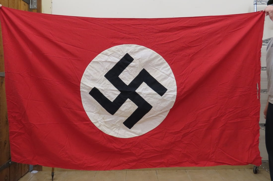 WWII Double Sided German Flag- Damaged: WWII Double Sided German Flag- Damaged - side with pole attachment is ripped. 44x74" some stains. LOT SIZE: 12x10x2" 2 LBS All information and photos, which are part of the description) are intended