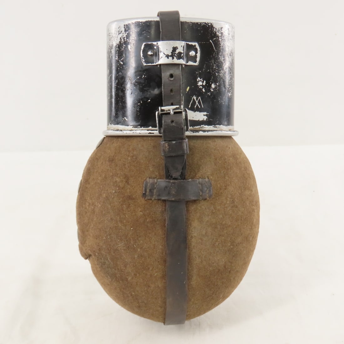 WWII German M31 Canteen with cup: WWII German M31 Canteen with cup - LOT SIZE: 10x6x4" 1 LB All information and photos, which are part of the description) are intended to be as accurate as possible, but errors are possible. No item ma