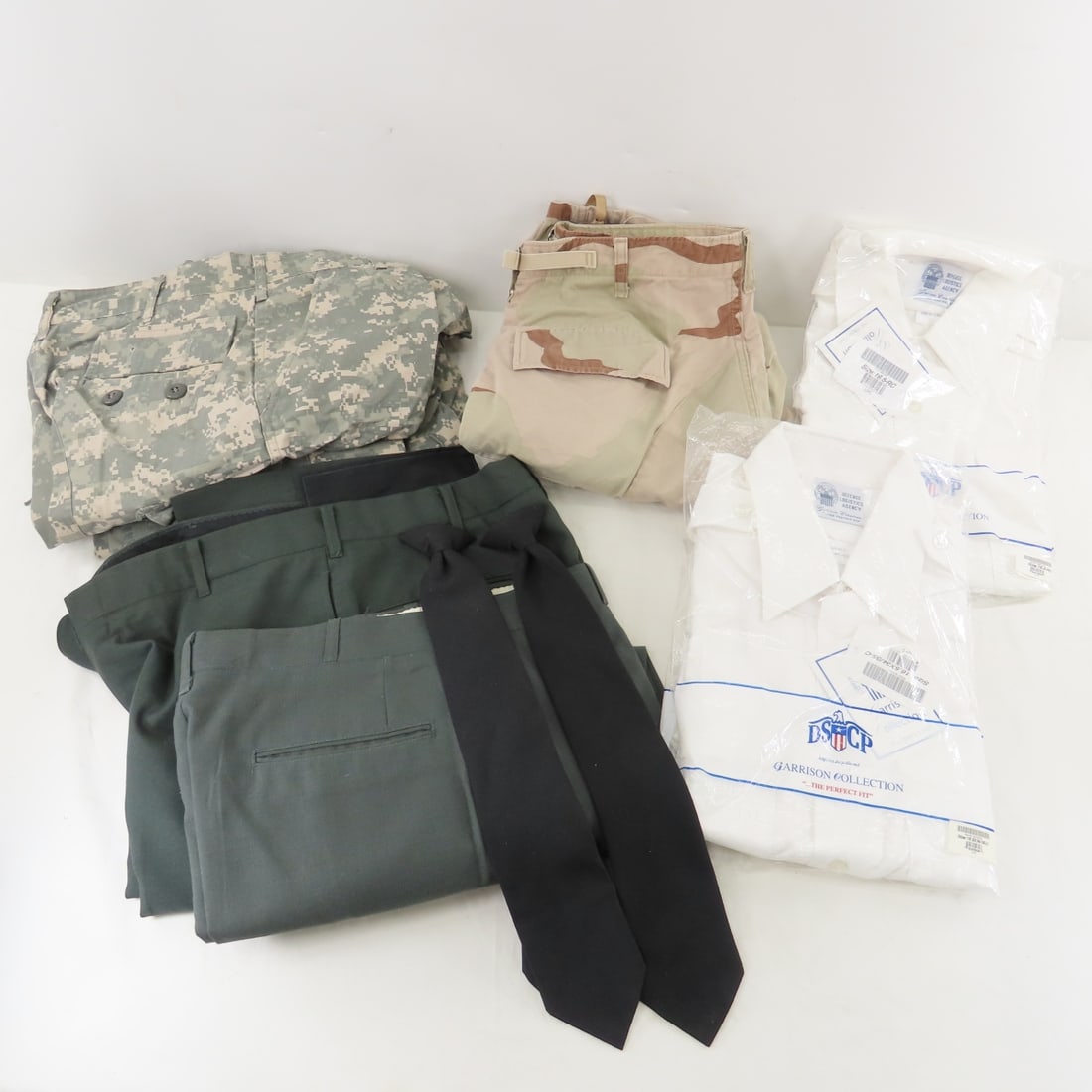 US Military Trousers & White Dress Shirts: US Military Trousers & White Dress Shirts - 2pr Digi-Camo Medium-Long Trousers Inseam 32-35", Waist 31-35". 2pr Serge Army Green Trousers 34x35" & 30XL. 1pr Desert Camo Medium-Long Trousers Inseam