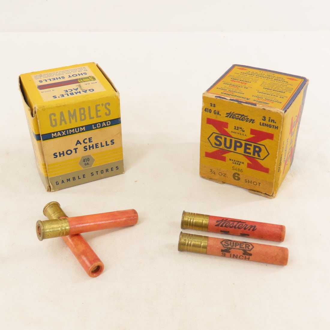25 Rounds Gamble's Ace 410 GA Paper Shot Shells: 25 Rounds Gamble's Ace 410 GA Paper Shot Shells - Original box and shells, original hand written price of $1.74 on box. Plus Partial box of 15 Rounds Vintage Western Super X 410 ga. LOT SIZE: 6x3x3"