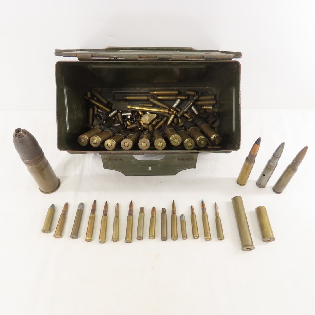 10 Rounds 1944 TW 50 Cal. Ammunition & More: 10 Rounds 1944 TW 50 Cal. Ammunition & More - Demilled larger rounds & 50 cal, mixed brass, mixed rifle ammunition, all in Metal Military Ammunition Can. LOT SIZE: 12x8x7" 15 LBS All information and