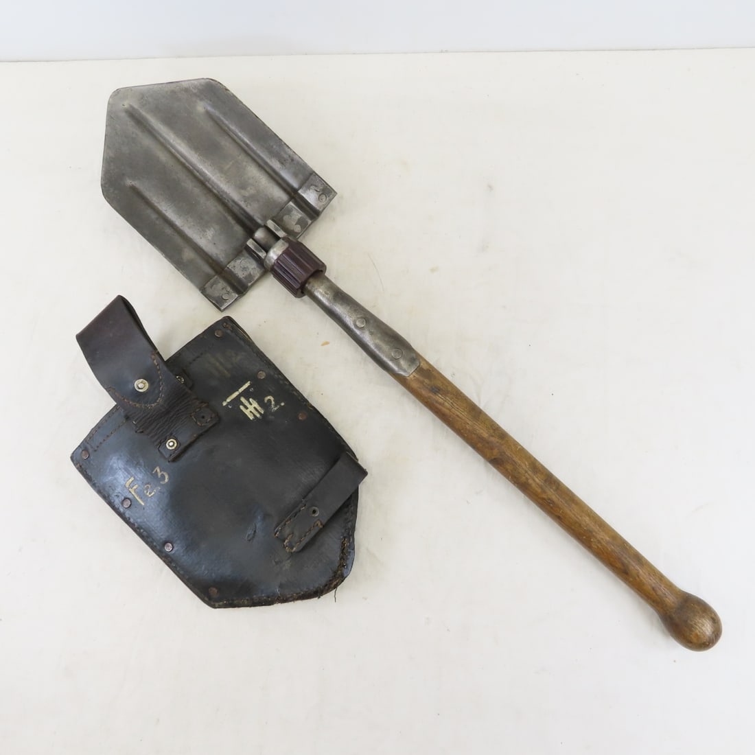 1939 German Folding Trench Shovel with Cover: 1939 German Folding Trench Shovel with Cover - shovel blade marked DOV, cover marked 1939 Ehrhardt & Kirsten TAUCHA lot size: 22X7X4" 3 lbs All information and photos, which are part of the descriptio