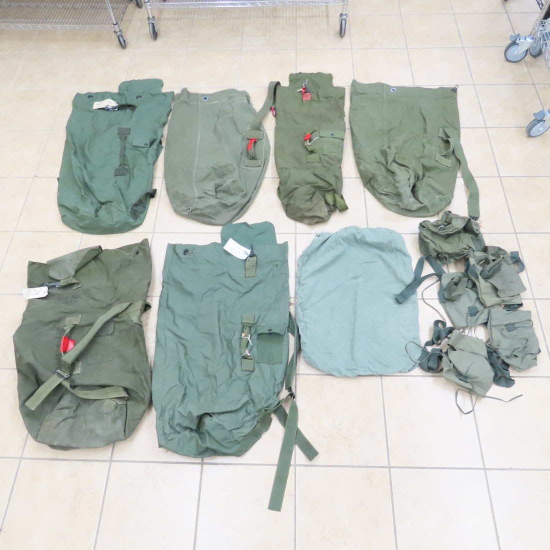 Vintage US Military Duffel Bags & Other Pouches: Vintage US Military Duffel Bags & Other Pouches - 7 Long Green Duffel Bags & Others. LOT SIZE: 18x18x12" 17 LBS All information and photos, which are part of the description) are intended to be as acc