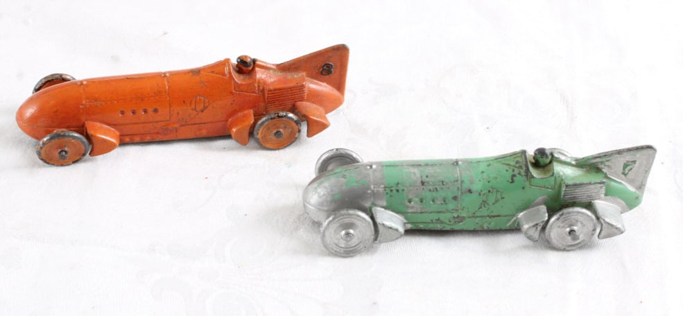2 Tootsietoy Race Cars #7 & #8: 2 Tootsietoy Race Cars #7 & #8 - Some Wear. Lot Size 4" x 3" x 2". .5 Lb. All information and photos, which are part of the description, are intended to be as accurate as possible, but errors are