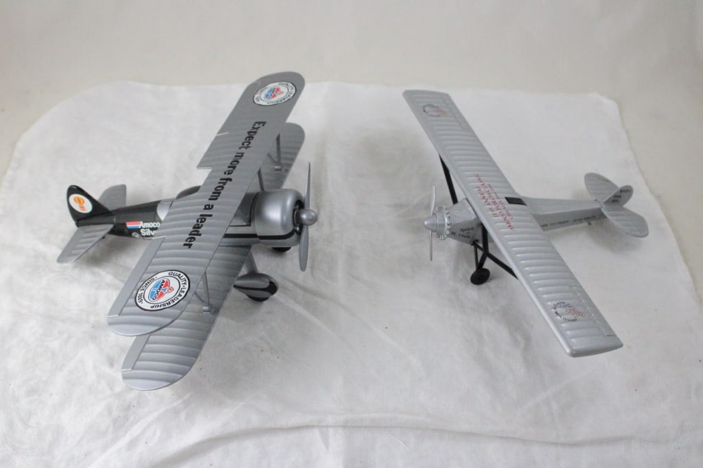 2 Diecast Gas & Oil Advertising Airplane Banks: 2 Diecast Gas & Oil Advertising Airplane Banks - Amoco Advertising diecast plane banks. Lot Size 15" 10" x 3.5". 3 Lbs. All information and photos, which are part of the description, are intended to b