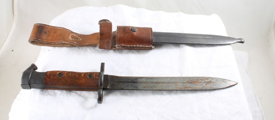 Bayonet with Sheath and Frog: Bayonet with Sheath and Frog - Lot Size 16" x 3" x 3". 2 Lbs. All information and photos, which are part of the description, are intended to be as accurate as possible, but errors are possible. No