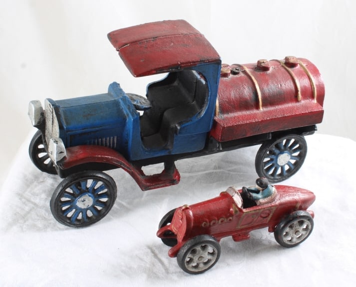 2 Cast Iron Toys C Cap Truck & Race Car: 2 Cast Iron Toys C Cap Truck & Race Car - Lot Size 10" x 6" x 6". 7 Lbs. All information and photos, which are part of the description, are intended to be as accurate as possible, but errors are
