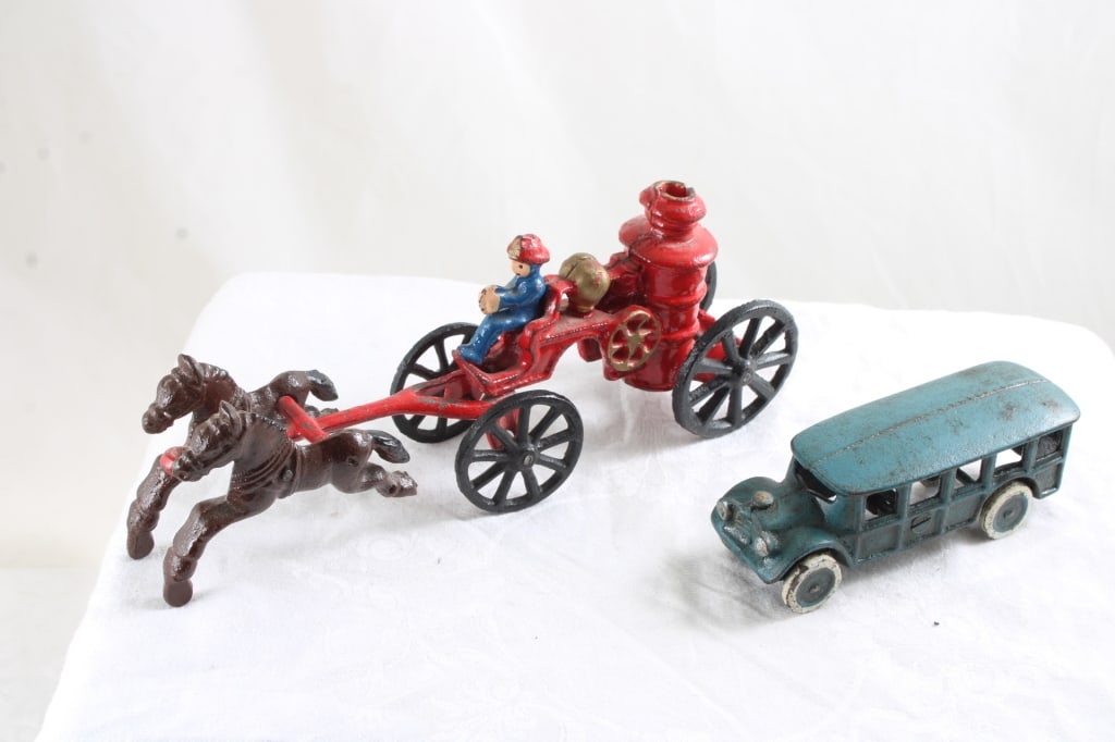 Cast Iron Horse Drawn Fire Pumper, & Touring Bus: Cast Iron Horse Drawn Fire Pumper, & Touring Bus - Works. Lot Size 9" x 6" x 4". 4 Lbs. All information and photos, which are part of the description, are intended to be as accurate as possible, but