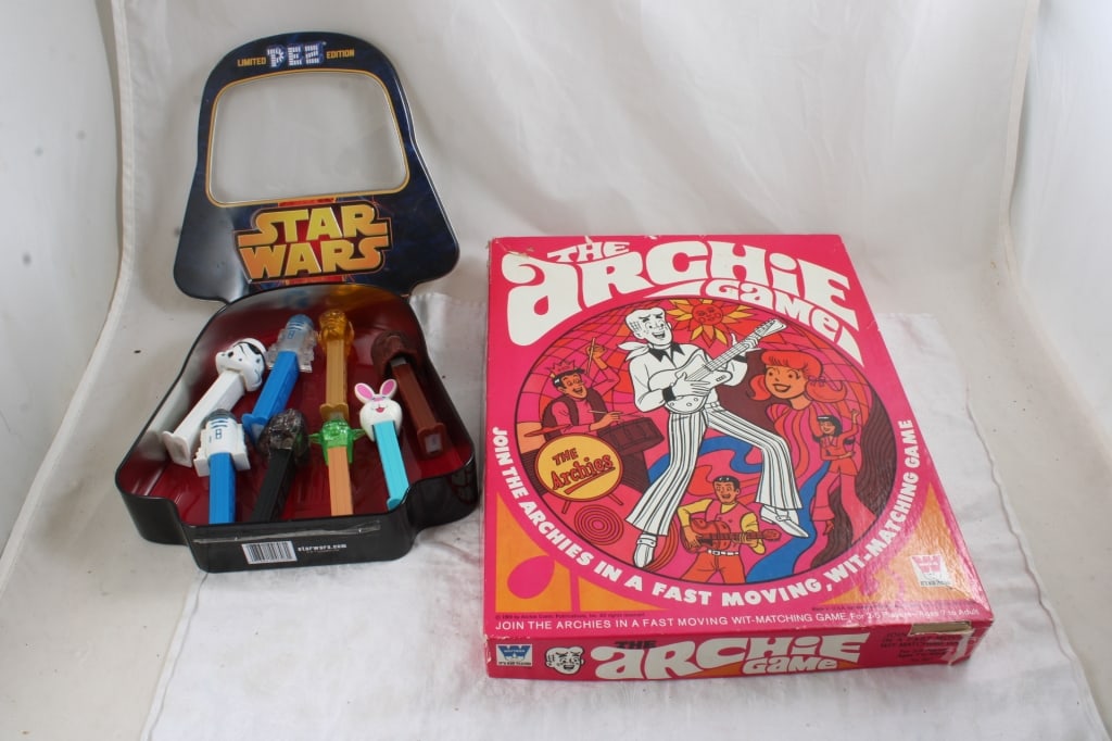 1969 Archie Whitman Game & Star Wars Collector Tin: 1969 Archie Whitman Game & Star Wars Collector Tin - with 7 Star Wars Pez figures and 1 Bunny Pez figure. Lot Size 12" x 15" x 5". 3 Lbs. Archie Comics Game is missing Reggie Game piece, but is otherw