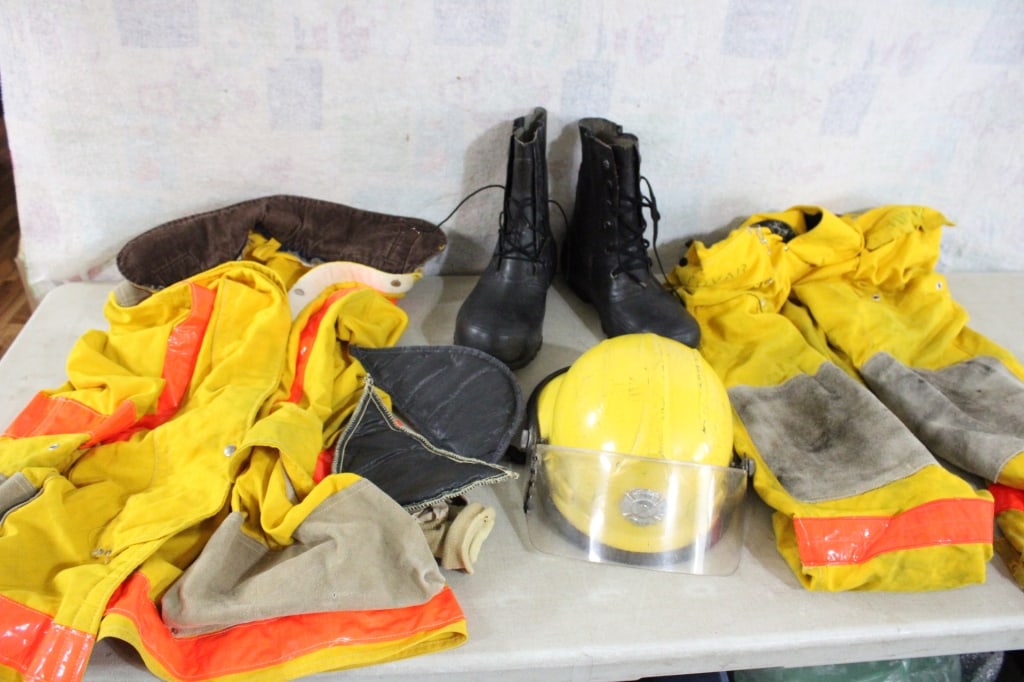 Bullard Fireman Helmet, Clothing, Boots in Tote: Bullard Fireman Helmet, Clothing, Boots in Tote - Lot Size 24" x 18" x 17". 20 Lbs. All information and photos, which are part of the description, are intended to be as accurate as possible, but
