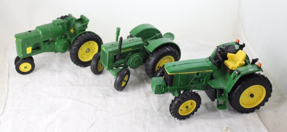 3 John Deere Die Cast Tractors #630, #6410 & D: 3 John Deere Die Cast Tractors #630, #6410 & D - Lot Size 15" x 10" x 5". 7 Lbs. All information and photos, which are part of the description, are intended to be as accurate as possible, but errors