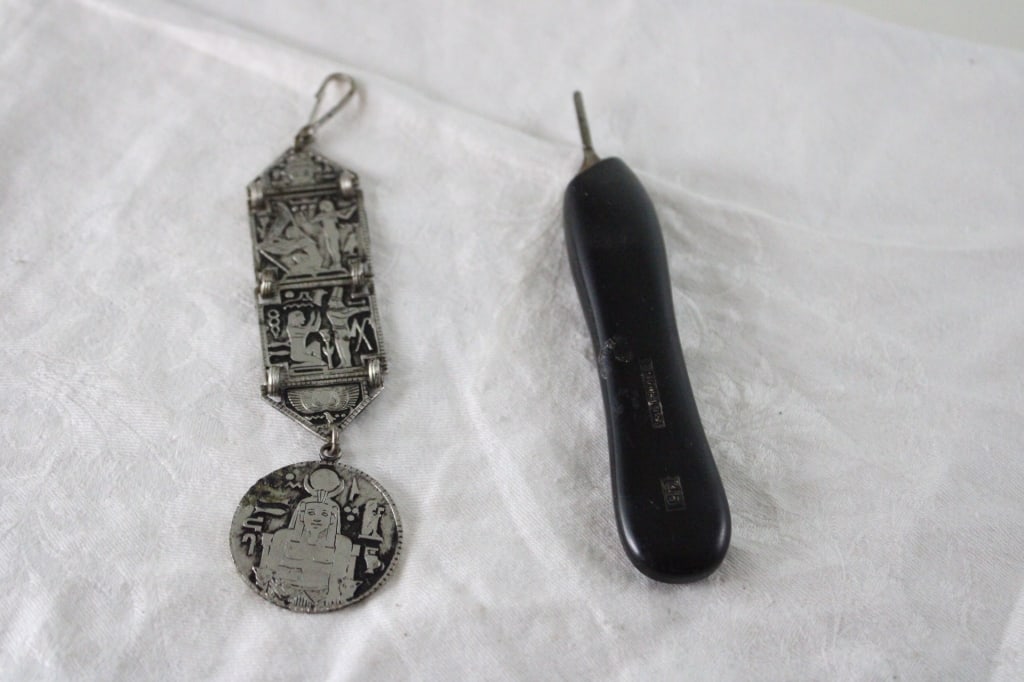 1920s Egyptian Revival Watch Fob, Autopsy Scalpel: 1920s Egyptian Revival Watch Fob, Autopsy Scalpel - Bard-Parker Surgical Autopsy Scalpel/Handle #46 Black and 1920's Egyptian Revival Silverplated Watch Fob. Lot Size 5" x 3" x 1". 1 Lb. All