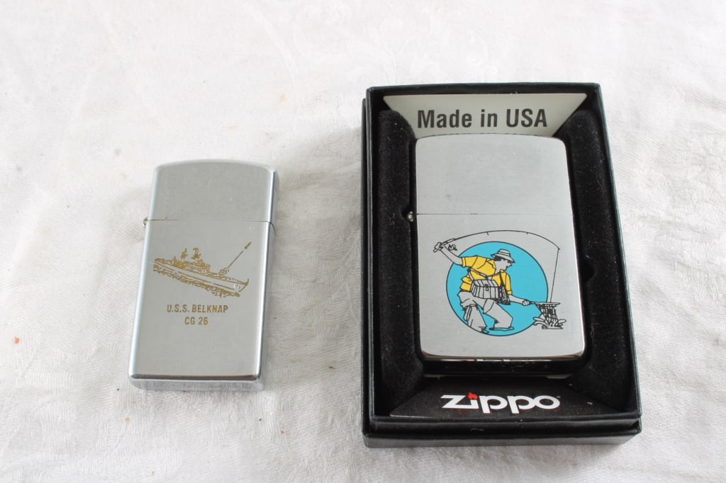 1968 Fisherman Zippo & 1976 Ship Lighters: 1968 Fisherman Zippo & 1976 Ship Lighters - 1976 USS Belknap Ship Slim Lighter. Lot Size 4" x 3" x 2". .5 Lb. All information and photos, which are part of the description, are intended to be as