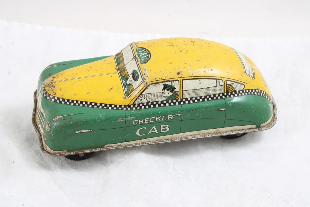 Courtland Tin Litho Checkered Windup Taxi Cab: Courtland Tin Litho Checkered Windup Taxi Cab - Works. Lot Size 7" x 4" x 3". 1 Lb. All information and photos, which are part of the description, are intended to be as accurate as possible, but error