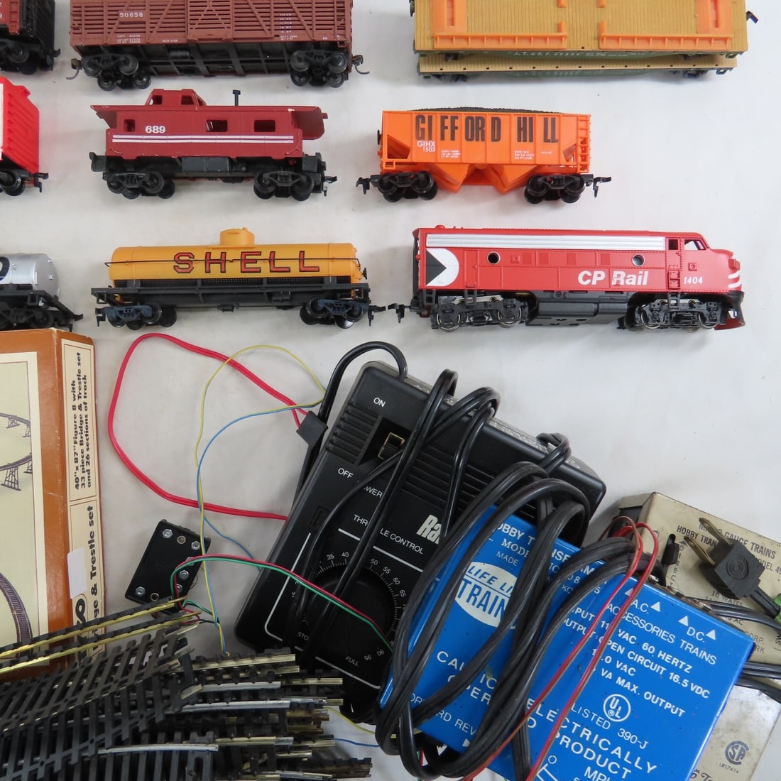 Assorted HO Scale Engines, Train Cars & Track - 10