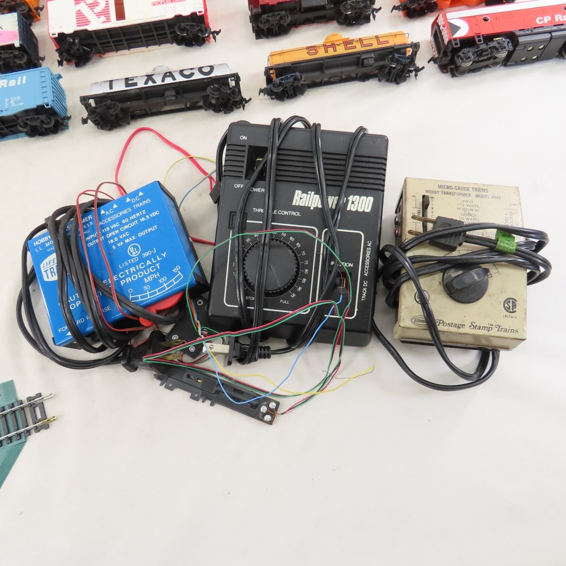 Assorted HO Scale Engines, Train Cars & Track - 11