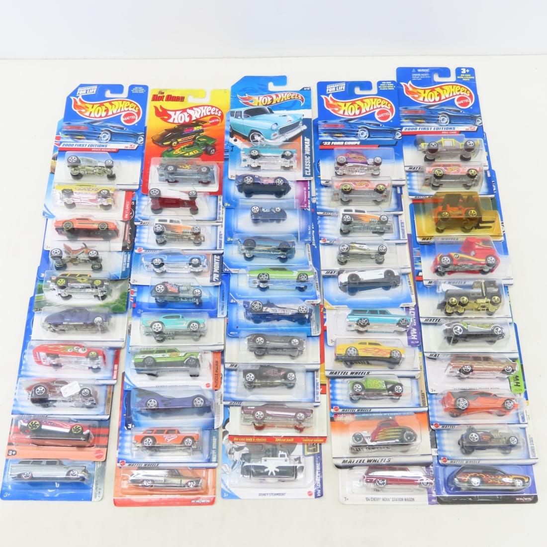 50 1990s & 2000s Hot Wheels Diecast Cars on cards: 50 1990s & 2000s Hot Wheels Diecast Cars on cards - Some Cards will likely have minor damage/bends. LOT SIZE: 10x10x10" 8 LBS All information and photos, which are part of the description) are