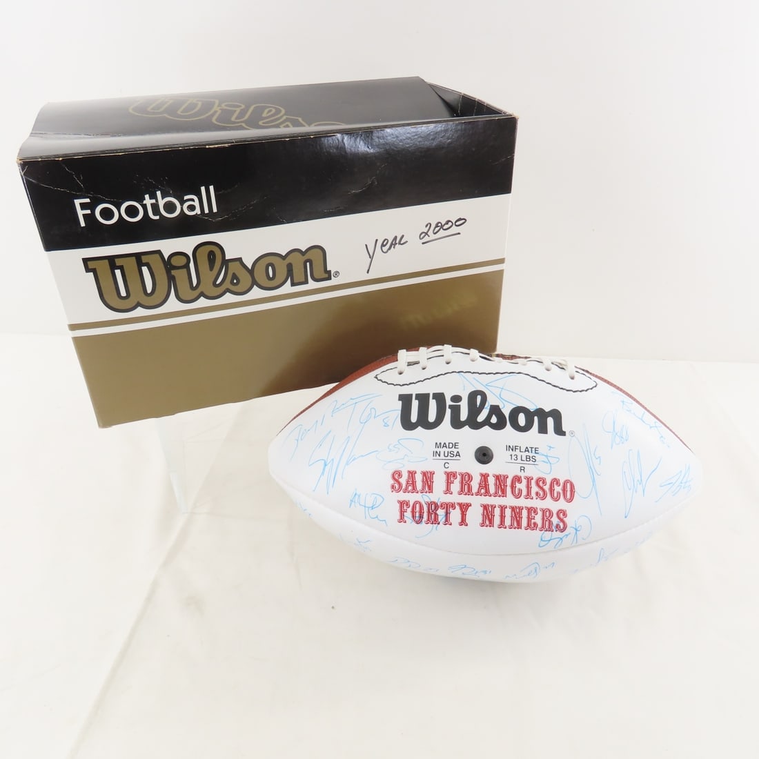 2000 SF 49er's Signed Ball- Jerry Rice & Others: 2000 SF 49er's Signed Ball- Jerry Rice & Others - Terrell Owens, Steve Mariucci & others, Official NFL Wilson ball in box from the estate of Tom Batta- tight end coach. LOT SIZE: 12x7x7" 1 LB All