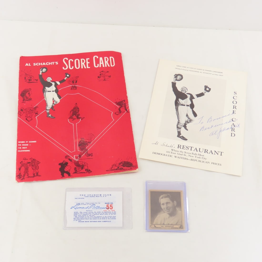 Al Schacht's Scorecards & Menu- 1 Signed & More: Al Schacht's Scorecards & Menu- 1 Signed & More - Al Schacht was known as "The Clown Prince of Baseball", 1940 Gum card, game 55 1959 stadium club at Yankees stadium ticket. LOT SIZE: 14x10x1' 1 LB
