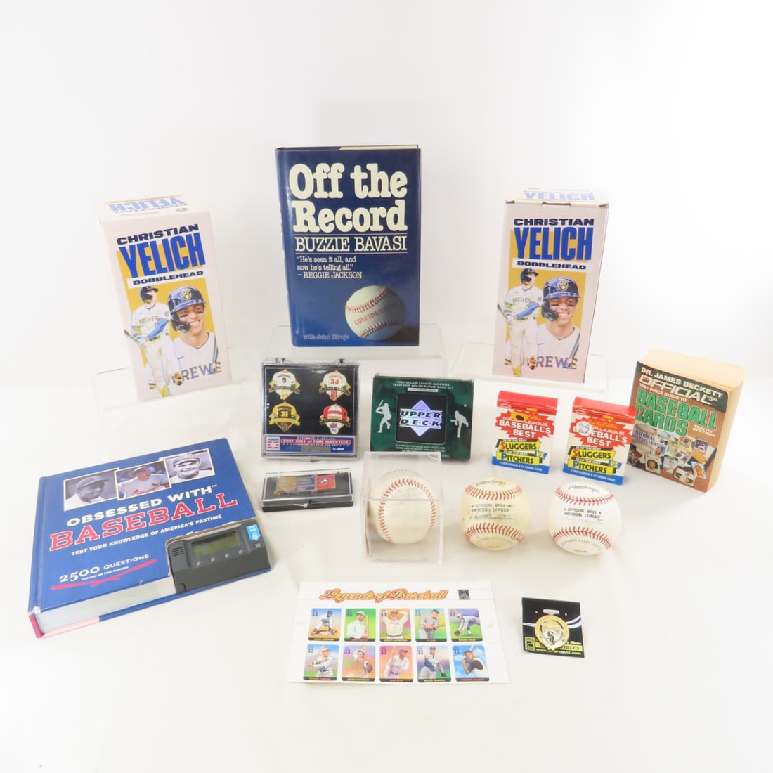 Bobbleheads, Baseballs, Pins & Collectibles: Bobbleheads, Baseballs, Pins & Collectibles - Rogers Hornsby Special League ball in case, 2 Christian Yelich bobbleheads in boxes, "Off the Record " by Bavasi HCDJ, "Obsessed with Baseball" with