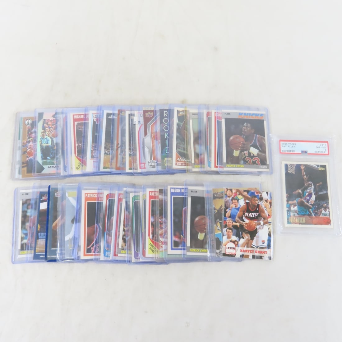 35+ 1980s & 90s Star Basketball Cards, 1 PSA 8: 35+ 1980s & 90s Star Basketball Cards, 1 PSA 8 - LOT SIZE: 6x4x1" 1 LB All information and photos, which are part of the description, are intended to be as accurate as possible, but errors are