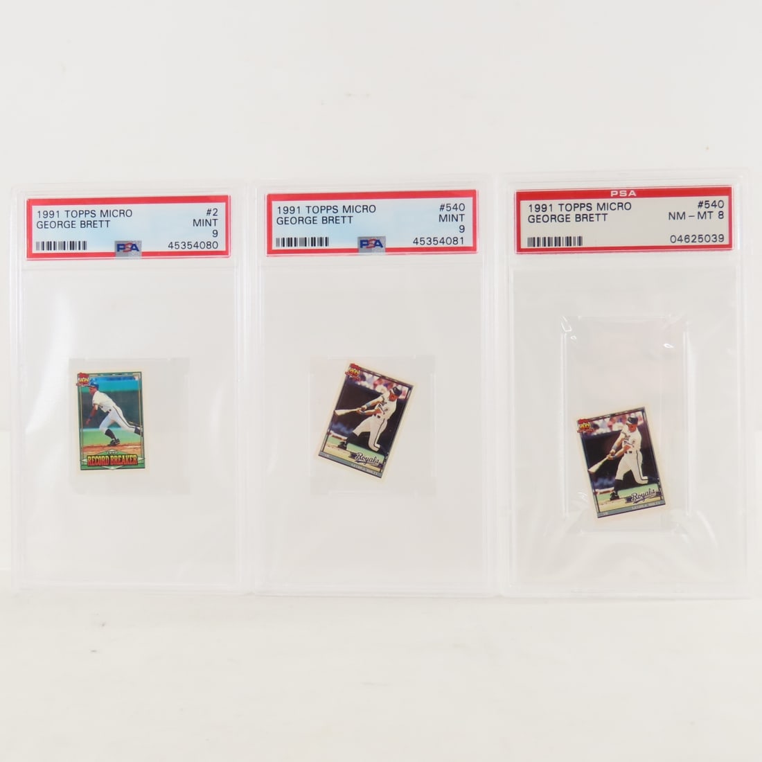 3 1991 Topps Micro George Brett #2 & #540 PSA: 3 1991 Topps Micro George Brett #2 & #540 PSA - #2 PSA 9 MINT, #540 PSA 9 MINT, #540 PSA 8 NM-MT. Lot Size 5.5x3.5x1" 1 LB All information and photos, which are part of the description, are intended