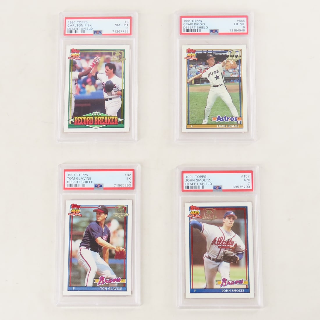 4 PSA 1991 Topps Desert Shield Baseball cards: 4 PSA 1991 Topps Desert Shield Baseball cards - Tom Glavine #82 PSA 5 EX, Carlton Fisk #3 PSA 8 NM-MT, Craig Biggio #565 PSA 6 EX-MT, & John Smoltz #157 PSA 7 NM. Lot Size 5.5x3.5x1" 1 LB All informat