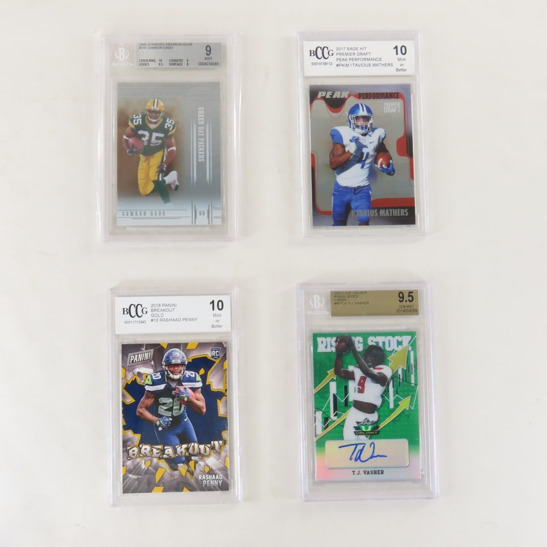 4 Beckett Graded Football Cards 2005-2021: 4 Beckett Graded Football Cards 2005-2021 - 2005 Donruss Gridiron Gear #141 Samkon Gado Beckett 9 Mint, 2017 Sage Hit Premier Draft Peak Performance #PKIM I'Tavious Mathers BCCG 10 Mint or Better,