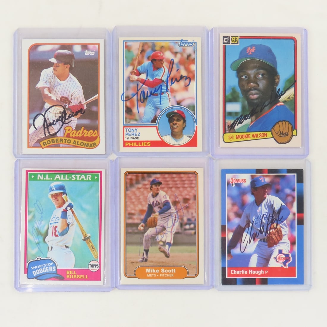 6 Autographed 1980's Baseball Cards: 6 Autographed 1980's Baseball Cards - Alomar, Perez, Wilson, Russell, Scott, Hough. LOT SIZE: 4x3x1" 1 LB All information and photos, which are part of the description, are intended to be as accurate