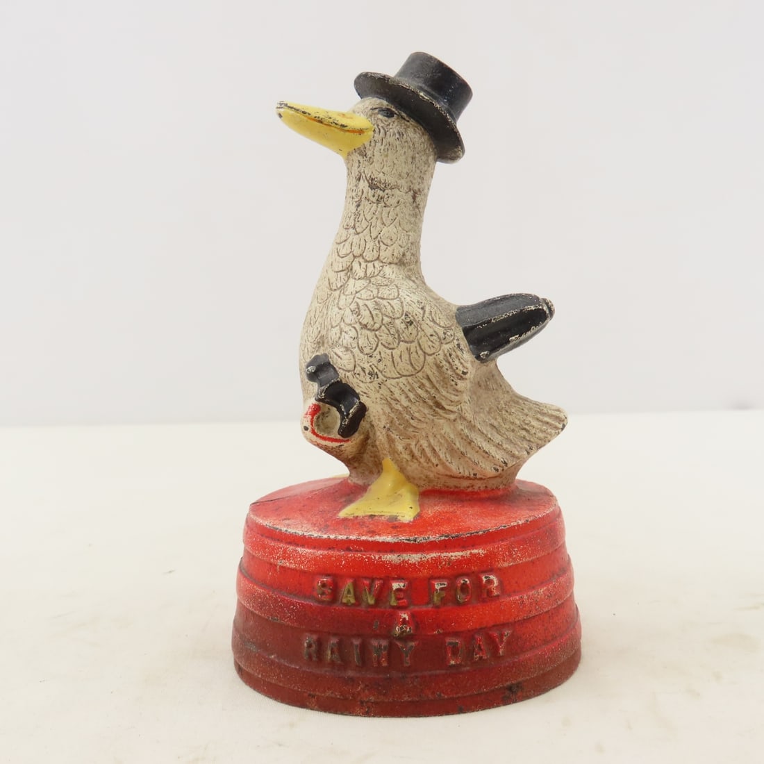 Antique Hubley Cast Iron "Rainy Day" Duck Bank: Antique Hubley Cast Iron "Rainy Day" Duck Bank - "Save For a Rainy Day". LOT SIZE: 6x4x4" 1 LB All information and photos, which are part of the description, are intended to be as accurate as