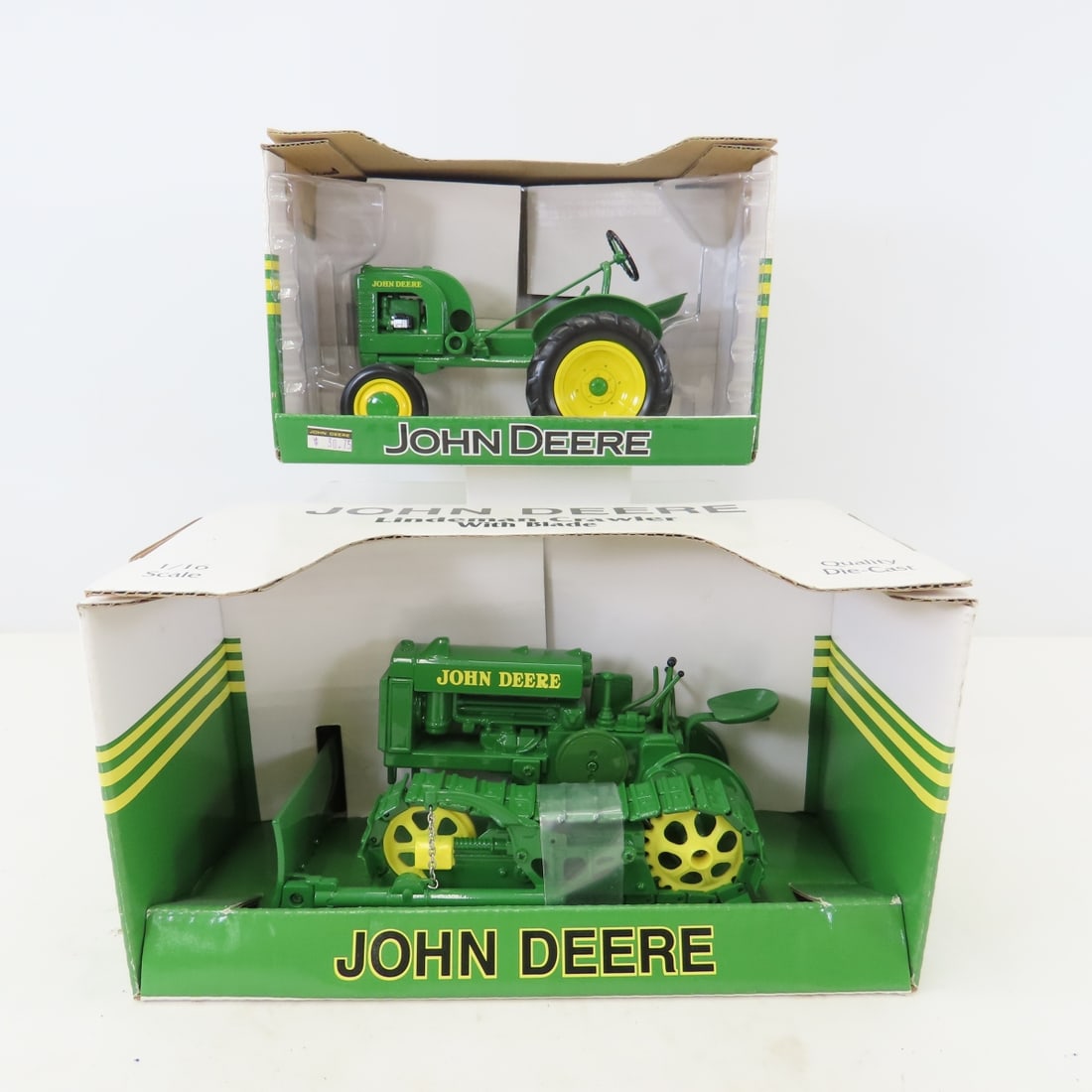 SpecCast 1:16 John Deere "L" & Lindeman Crawler: SpecCast 1:16 John Deere "L" & Lindeman Crawler - Lindeman Crawler with Blade, Model "L" with Hercules Engine. in boxes LOT SIZE: 11x10x6" 5 LBS All information and photos, which are part of the