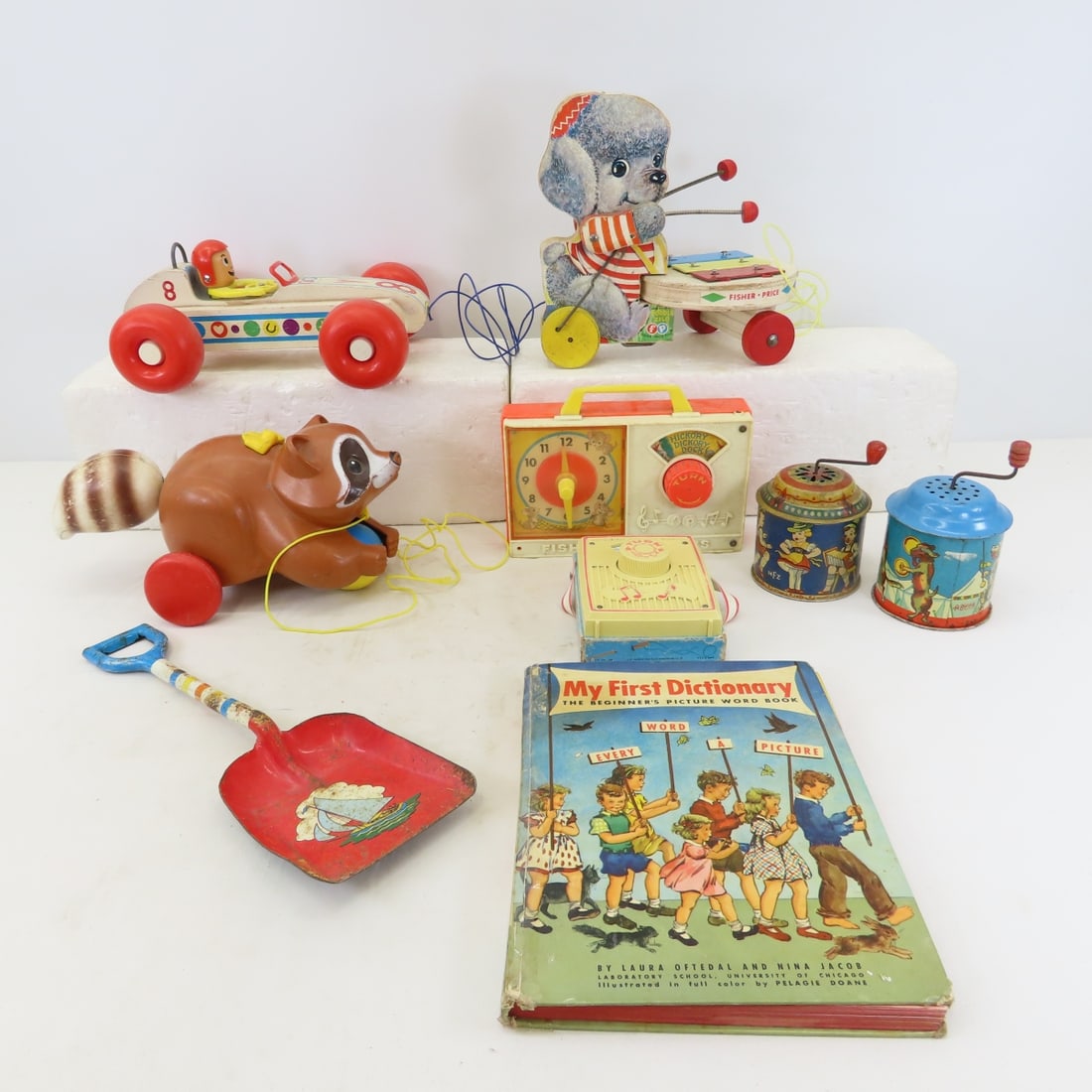 Vintage Fisher Price Pull Toys, Music Boxes, Book: Vintage Fisher Price Pull Toys, Music Boxes, Book - Bear, Raccoon, Race Car. LOT SIZE: 18x14x8" 6 LBS All information and photos, which are part of the description, are intended to be as