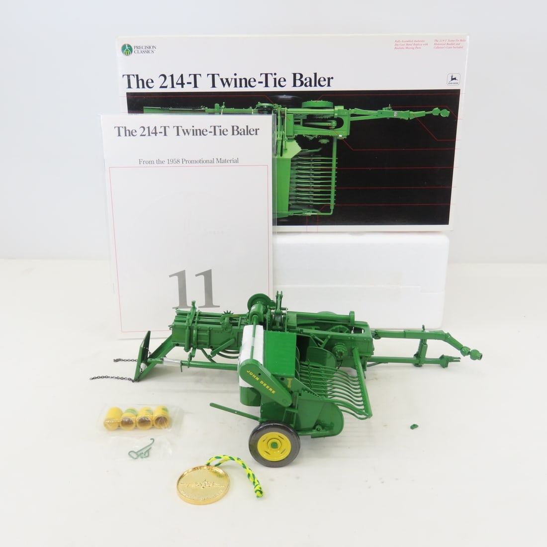 ERTL Precision 1:16 John Deere 214-T Baler: ERTL Precision 1:16 John Deere 214-T Baler - Diecast Metal. Precision Classics with Coin & booklet in box. LOT SIZE: 14x8x4" 2 LBS All information and photos, which are part of the description, are