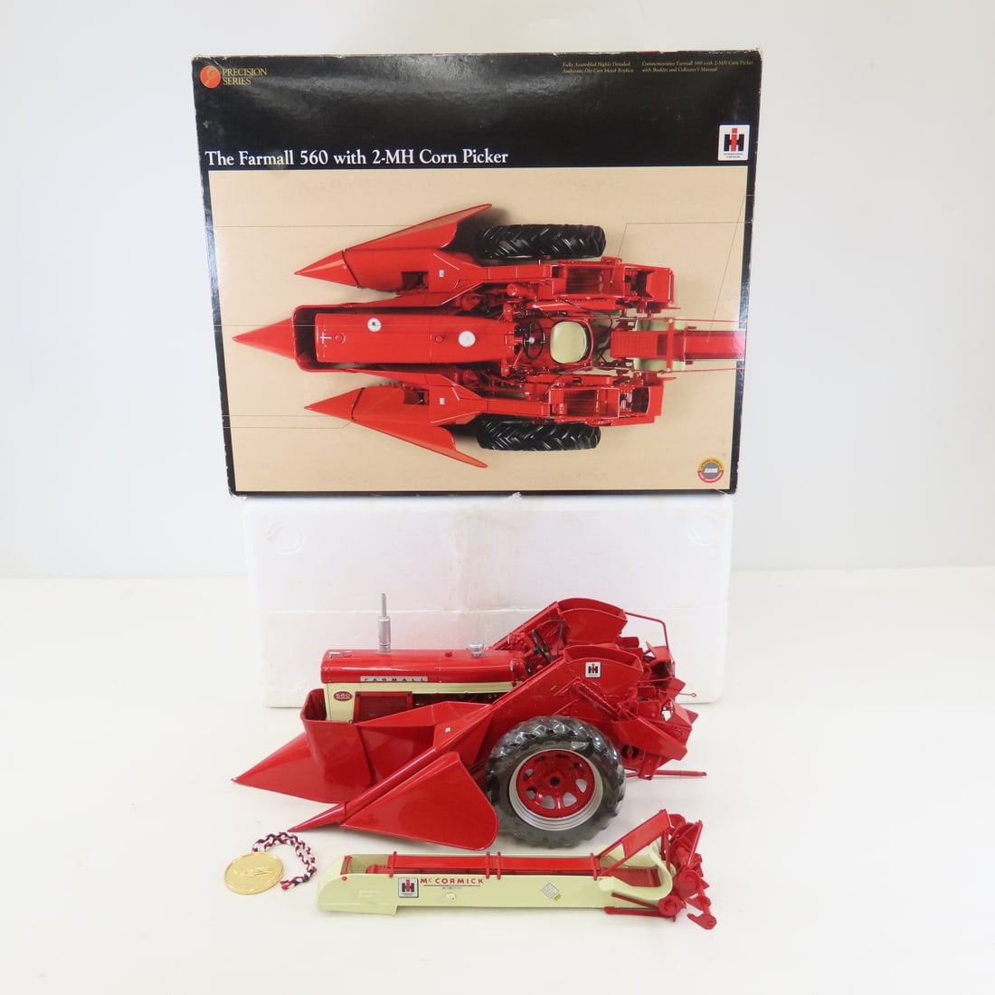 ERTL Precision1:16 Farmall 560 w/2-MH Corn Picker: ERTL Precision1:16 Farmall 560 w/2-MH Corn Picker - Diecast Metal. Precision Series with Coin & booklet in box. LOT SIZE: 16x13x8" 8 LBS All information and photos, which are part of the description,